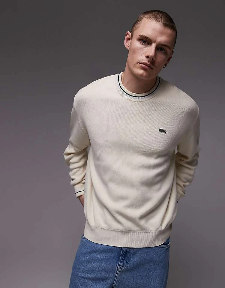 Lacoste Long Sleeve Crewneck Jumper In White With Piping Detail For Men 1 Lacoste Long Sleeve Crewneck Jumper In White With Piping Detail For Men